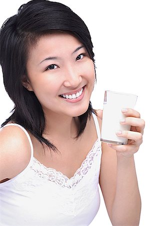 simsearch:656-01771940,k - Young woman with glass of milk, portrait Fotografie stock - Premium Royalty-Free, Codice: 656-01772004
