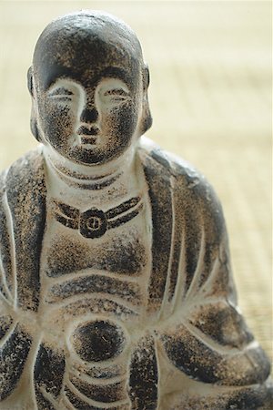 Close-up of small Buddha sculpture Stock Photo - Premium Royalty-Free, Code: 656-01772090