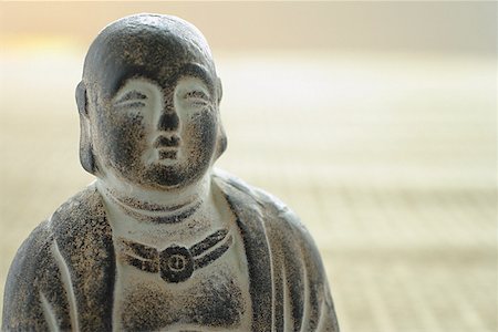 Still life of small Buddha sculpture Stock Photo - Premium Royalty-Free, Code: 656-01772091