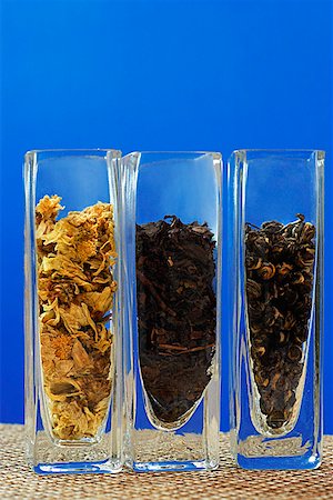 simsearch:656-01771172,k - Row of three glass containers with tea leaves Fotografie stock - Premium Royalty-Free, Codice: 656-01772616