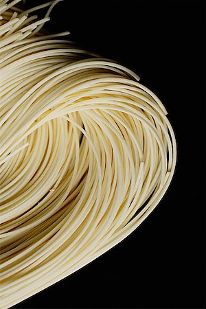 simsearch:656-01772085,k - Chinese noodles against black background, close up Stock Photo - Premium Royalty-Free, Code: 656-01772646