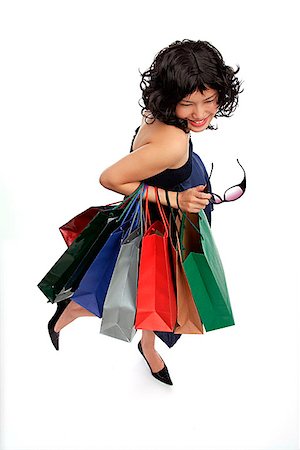simsearch:656-02702780,k - Woman carrying many shopping bags high angle view Foto de stock - Sin royalties Premium, Código: 656-01772722