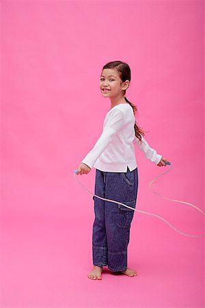 Girl with skipping rope Stock Photo - Premium Royalty-Free, Code: 656-01772798