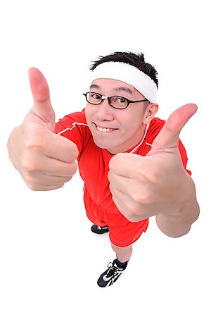 Man in soccer uniform making thumbs up sign Stock Photo - Premium Royalty-Free, Code: 656-01773064