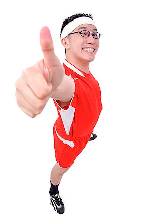 Man in soccer uniform making thumbs up sign Stock Photo - Premium Royalty-Free, Code: 656-01773061