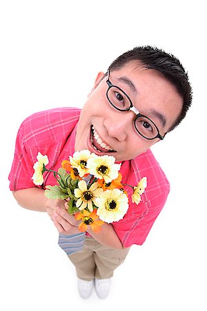 passion flower - Man holding flower bouquet, smiling at camera Stock Photo - Premium Royalty-Free, Code: 656-01773079