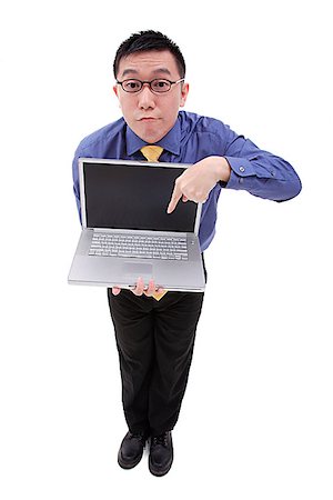 dorky businessman - Businessman pointing at laptop Stock Photo - Premium Royalty-Free, Code: 656-01773110
