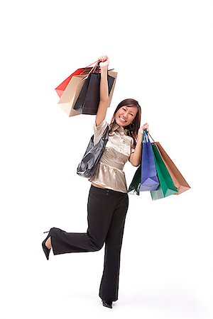 simsearch:656-01771655,k - Woman carrying shopping bags, arms outstretched Foto de stock - Sin royalties Premium, Código: 656-01773148
