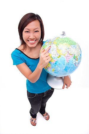 excursion scolaire - Woman holding globe, smiling at camera Foto de stock - Sin royalties Premium, Código: 656-01773186