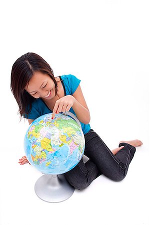 excursion scolaire - Woman pointing at globe Foto de stock - Sin royalties Premium, Código: 656-01773188