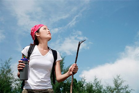 Female hiker looking up, low angle view Stock Photo - Premium Royalty-Free, Code: 656-01773282