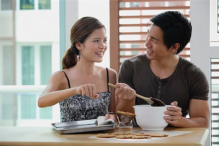 Couple in kitchen, making cookies Stock Photo - Premium Royalty-Free, Code: 656-01773424
