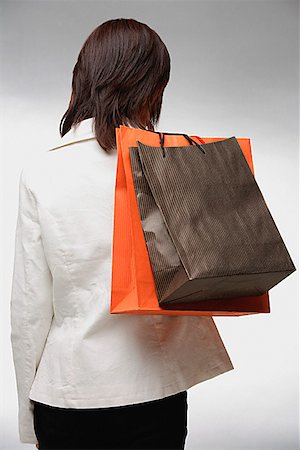 simsearch:656-01773308,k - Femme portant des sacs à provisions, rearview Photographie de stock - Premium Libres de Droits, Code: 656-01773520