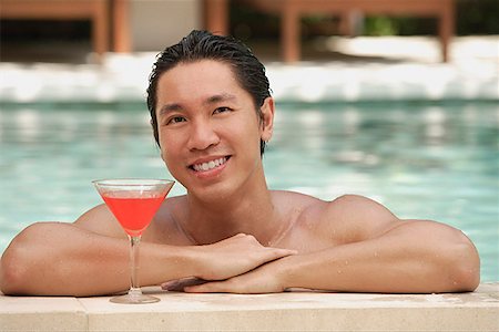 sunbathing with cocktail - Man in swimming pool, leaning on the edge Stock Photo - Premium Royalty-Free, Code: 656-01773747