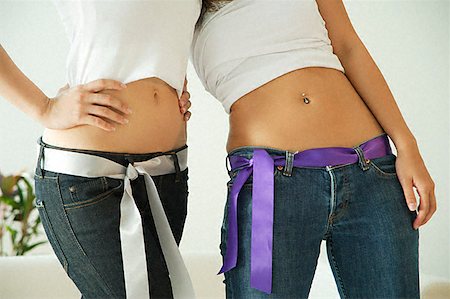 Woman belly button jeans hi-res stock photography and images