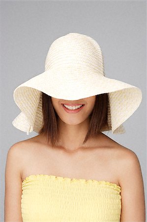 eurasian - Young woman with big sun hat Stock Photo - Premium Royalty-Free, Code: 656-02371670
