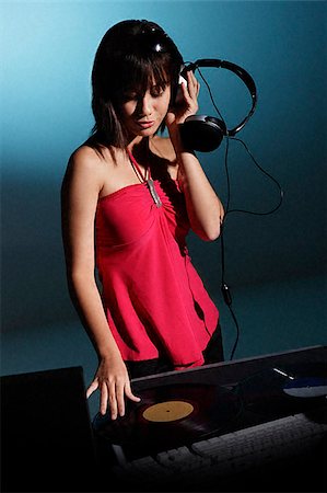 record - Young woman DJ Stock Photo - Premium Royalty-Free, Code: 656-02371720