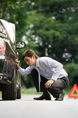 Man inspecting car Stock Photo - Premium Royalty-Free, Code: 656-02371858