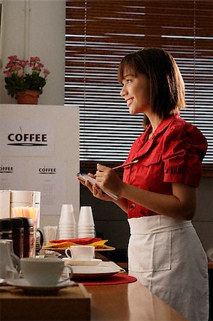 Waitress in diner taking order Stock Photo - Premium Royalty-Free, Code: 656-02371851