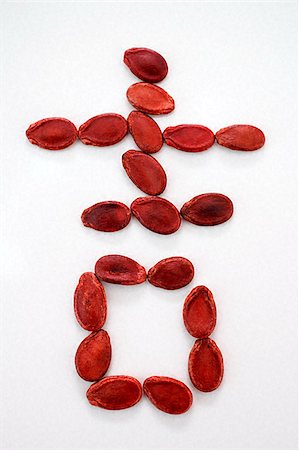 simsearch:656-02660265,k - Chinese character for "luck" formed with red melon seeds Foto de stock - Sin royalties Premium, Código: 656-02660196
