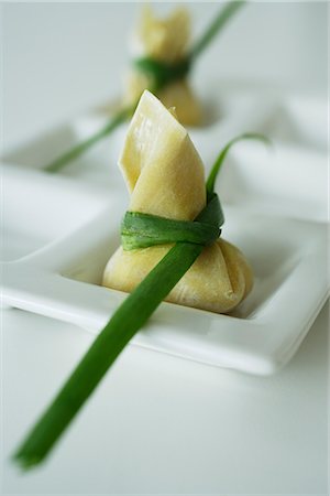 dim sum - wanton dumplings placed on a white dish Stock Photo - Premium Royalty-Free, Code: 656-02702811