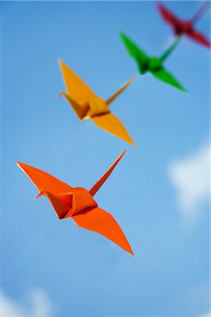 multiple paper cranes against sky backdrop Stock Photo - Premium Royalty-Free, Code: 656-02702821