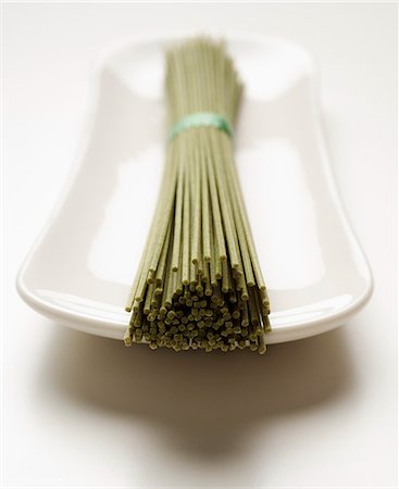 bunch of soba noodles placed on white plate front view Stock Photo - Premium Royalty-Free, Code: 656-02702875