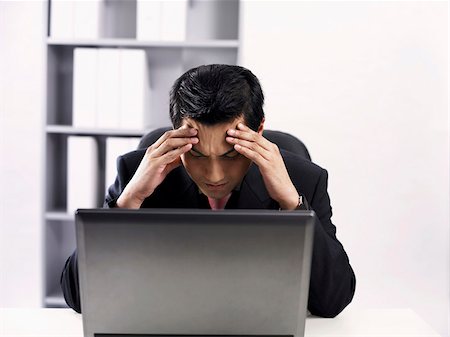 man using laptop feeling stressed up Stock Photo - Premium Royalty-Free, Code: 656-02879428