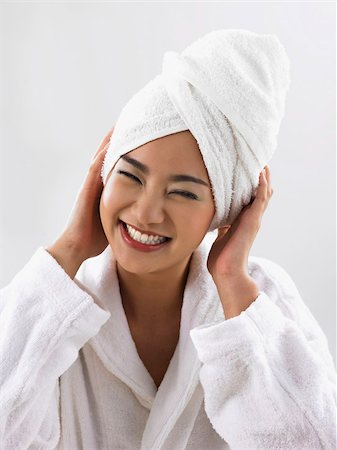 woman smiling with towel on her head Stock Photo - Premium Royalty-Free, Code: 656-02879462