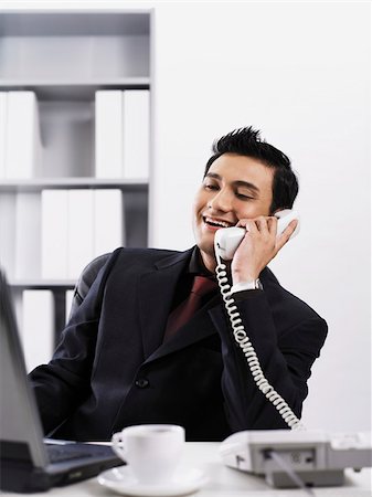 simsearch:656-04926450,k - man using a office phone Stock Photo - Premium Royalty-Free, Code: 656-02879478