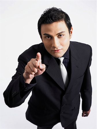 man pointing towards camera Stock Photo - Premium Royalty-Free, Code: 656-02879511