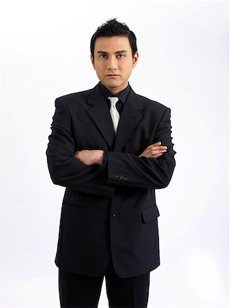 man looking strict, arms crossed Stock Photo - Premium Royalty-Free, Code: 656-02879523