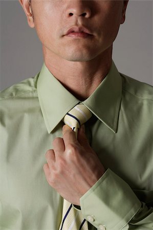 prova (spettacolo) - crop portrait of man tightening tie Fotografie stock - Premium Royalty-Free, Codice: 656-02879595