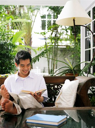 man reading a book at home Stock Photo - Premium Royalty-Free, Code: 656-02879651