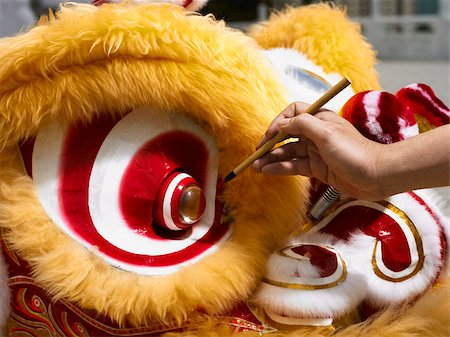 Person painting Chinese lion costume Stock Photo - Premium Royalty-Free, Code: 656-02879680