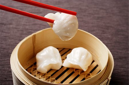 simsearch:656-03076253,k - red chopsticks holding dim sum Stock Photo - Premium Royalty-Free, Code: 656-03076242