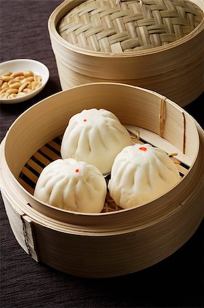 steaming basket - close up of dim sum in bamboo steamer Stock Photo - Premium Royalty-Free, Code: 656-03076257