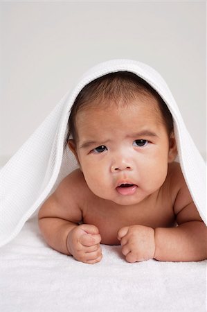 sad blanket - Chinese baby looking sad. Stock Photo - Premium Royalty-Free, Code: 656-03076284