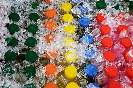 Colorful juice bottles covered in ice Stock Photo - Premium Royalty-Free, Code: 656-03240999