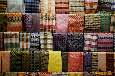 Bright colored sarongs hanging at a market Stock Photo - Premium Royalty-Free, Code: 656-03241051