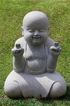simsearch:832-03233354,k - Stone statue of happy Buddha Fotografie stock - Premium Royalty-Free, Codice: 656-03519509