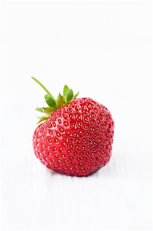 single strawberry fruit photography - A strawberry Stock Photo - Premium Royalty-Free, Code: 659-06154059