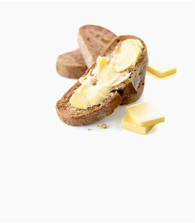 fett (fettreiche speisen) - Brotscheiben und Bauernhaus-butter Stockbilder - Premium RF Lizenzfrei, Bildnummer: 659-06154411