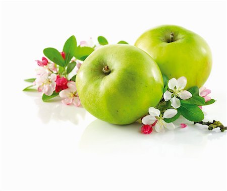 simsearch:659-06307305,k - Green apple and branch with apple blossom Stock Photo - Premium Royalty-Free, Code: 659-06154439