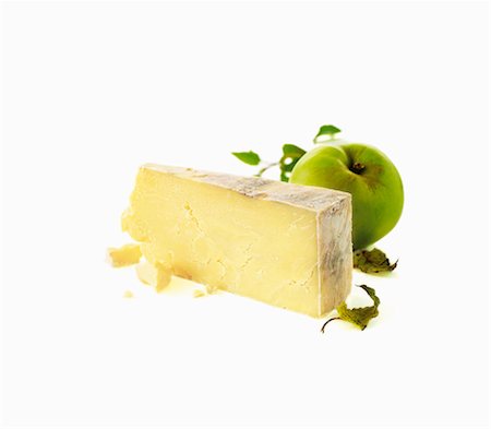 A piece of hard cheese and a green apple Stock Photo - Premium Royalty-Free, Code: 659-06154450