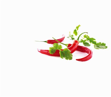 Chili peppers and cilantro Stock Photo - Premium Royalty-Free, Code: 659-06154480