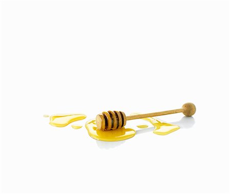 Honey with honey dipper Foto de stock - Sin royalties Premium, Código: 659-06154517