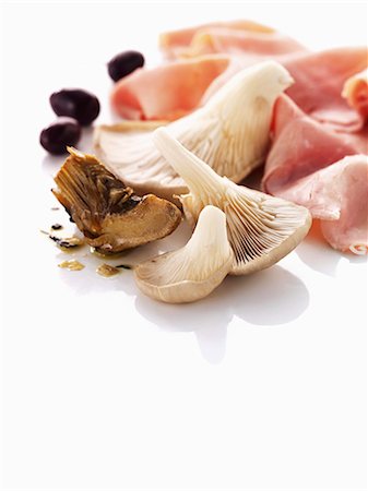 food still life - Oyster mushrooms, artichokes, olives and ham Stock Photo - Premium Royalty-Free, Code: 659-06154512