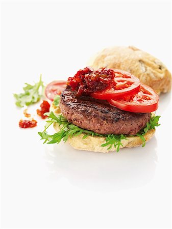 simsearch:659-03537275,k - Pork hamburger with tomatoes Foto de stock - Sin royalties Premium, Código: 659-06154544