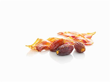 exotic meat - Dates and fried bacon Foto de stock - Sin royalties Premium, Código: 659-06154642